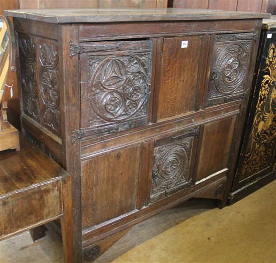 A carved oak cupboard, W.4ft 7in.